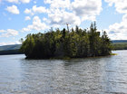 The island at Aspy Bay as viewed from the shoreline near Cape North.