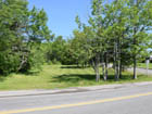 Property is located at the corner of Shore Road (main entrance to Baddeck) and Campbell Street.