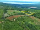 The property is outlined in yellow on this aerial photo of the area.