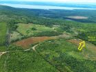 The location of the property is indicated by the arrow in this aerial photo of the area.