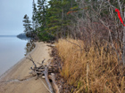 The property features a beautiful sandy beach. Red ribbon on right marks beginning of sand beach on lot 23-8.