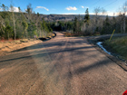 Rebuilt public road coming into developed area.